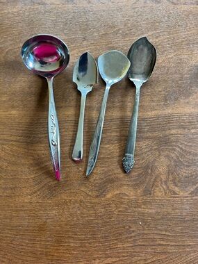 Set of four serving utensils , jelly server, serving spoon , sugar spoon and oth
